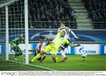 - GENT, BELGIUM: Valencia s goalkeeper Jaume Domenech, Valencia s Aderlan Santos, Gent s Laurent Depoitre and Valencia s Jose Luis Gaya fight for the ball during a soccer game between Belgian team KAA Gent and Spanish club Valencia CF in Gent, Wednesday 04 November 2015, game four in group H of the group stage of the UEFA Champions League tournament. YORICKxJANSENS  x04733477x