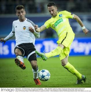 - GENT, BELGIUM: Valencia s Aderlan Santos and Gent s Danijel Milicevic fight for the ball during a soccer game between Belgian team KAA Gent and Spanish club Valencia CF in Gent, Wednesday 04 November 2015, game four in group H of the group stage of the UEFA Champions League tournament. YORICKxJANSENS  x04733506x