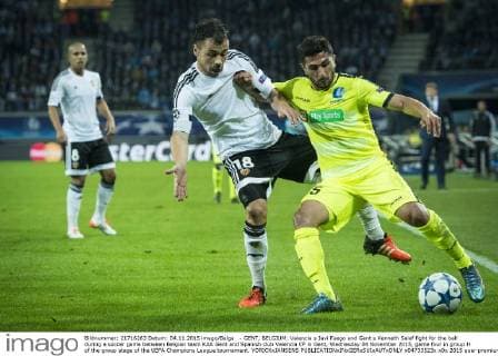 - GENT, BELGIUM: Valencia s Javi Fuego and Gent s Kenneth Saief fight for the ball during a soccer game between Belgian team KAA Gent and Spanish club Valencia CF in Gent, Wednesday 04 November 2015, game four in group H of the group stage of the UEFA Champions League tournament. YORICKxJANSENS  x04733523x