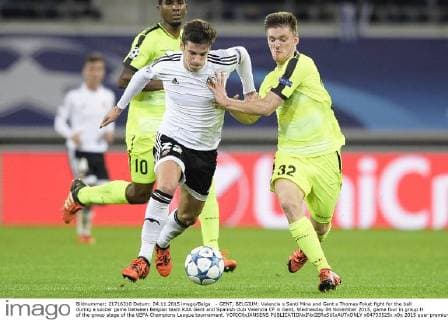 - GENT, BELGIUM: Valencia s Santi Mina and Gent s Thomas Foket fight for the ball during a soccer game between Belgian team KAA Gent and Spanish club Valencia CF in Gent, Wednesday 04 November 2015, game four in group H of the group stage of the UEFA Champions League tournament. YORICKxJANSENS  x04733525x