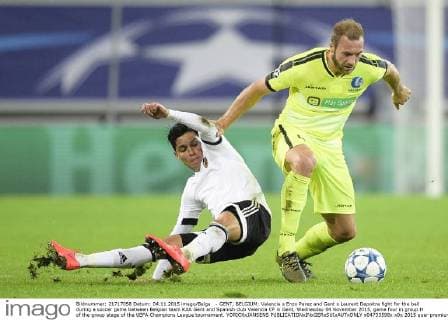 - GENT, BELGIUM: Valencia s Enzo Perez and Gent s Laurent Depoitre fight for the ball during a soccer game between Belgian team KAA Gent and Spanish club Valencia CF in Gent, Wednesday 04 November 2015, game four in group H of the group stage of the UEFA Champions League tournament. YORICKxJANSENS  x04733598x