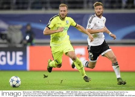 - GENT, BELGIUM: Gent s Laurent Depoitre and Valencia s Shkodran Mustafi fight for the ball during a soccer game between Belgian team KAA Gent and Spanish club Valencia CF in Gent, Wednesday 04 November 2015, game four in group H of the group stage of the UEFA Champions League tournament. YORICKxJANSENS  x04733599x