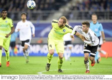 - GENT, BELGIUM: Gent s Laurent Depoitre and Valencia s Jose Luis Gaya fight for the ball during a soccer game between Belgian team KAA Gent and Spanish club Valencia CF in Gent, Wednesday 04 November 2015, game four in group H of the group stage of the UEFA Champions League tournament. YORICKxJANSENS  x04733636x