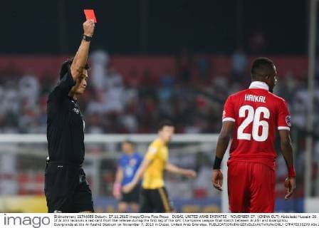 DUBAI, UNITED ARAB EMIRATES - NOVEMBER 07: (CHINA OUT) Abdulaziz Hussain 26 of Al Ahli receives a red card from the referee during the first leg of the AFC Champions League final match between Al Ahli and Guangzhou Evergrande at the Al-Rashid Stadium on November 7, 2015 in Dubai, United Arab Emirates.  CFP475535270 