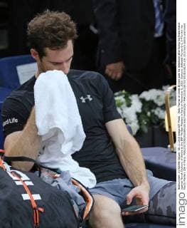 Andy Murray of Great Britain uses his telephone after losing his finals match against Novak Djokovic of Serbia at the BNP Paribas Masters in Paris on November 8, 2015. Djokovic defeated Murray 6-2, 6-4 to win his fourth Masters title in Paris.  PAR20151108733 DAVIDxSILPA