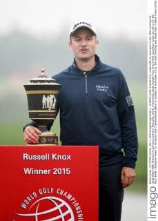 Scottish golfer Russell Knox poses with his champion trophy after winning the 2015 WGC-HSBC Champions golf tournament in Shanghai, China, 8 November 2015. Russell Knox fired a final round four-under-par 68 to win the WGC-HSBC Champions event on his World Golf Championships debut on Sunday (8 November 2015), the Scot finishing two shots clear of Kevin Kisner at the Sheshan International Golf Club. The only player not to complete his third round in fading light on Saturday, Knox returned to the course early on Sunday and birdied the par-five 18th to join American Kisner at the top of the leaderboard after 54 holes. The 30-year-old then used some supreme wedge play to offset two bogeys with six birdies on his way to a 20-under 268 total to become the first Scot to win a WGC event and also the first debutant to claim victory since Jeff Maggert in 1999. Knox springs Shanghai surprise for maiden WGC win  pbu358008_62