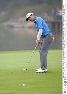 American golfer Kevin Kisner putts during the final round of the 2015 WGC-HSBC Champions golf tournament in Shanghai, China, 8 November 2015. Russell Knox fired a final round four-under-par 68 to win the WGC-HSBC Champions event on his World Golf Championships debut on Sunday (8 November 2015), the Scot finishing two shots clear of Kevin Kisner at the Sheshan International Golf Club. The only player not to complete his third round in fading light on Saturday, Knox returned to the course early on Sunday and birdied the par-five 18th to join American Kisner at the top of the leaderboard after 54 holes. The 30-year-old then used some supreme wedge play to offset two bogeys with six birdies on his way to a 20-under 268 total to become the first Scot to win a WGC event and also the first debutant to claim victory since Jeff Maggert in 1999. Knox springs Shanghai surprise for maiden WGC win  pbu358008_95