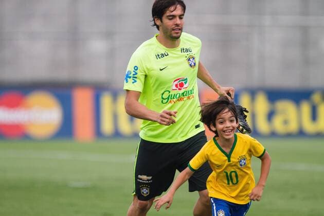 Training Selection Home Brazilian Sao Paulo, Brazil - 10 11 2015: SELECTION TRAINING HOME BRAZILIAN - Kaka playing with his son Luca and a colleague during training the Brazilian Principal Selection held at CT Joaquim Grava Corinthians. (Photo: Fe Reis FotoArena)  FexReis
