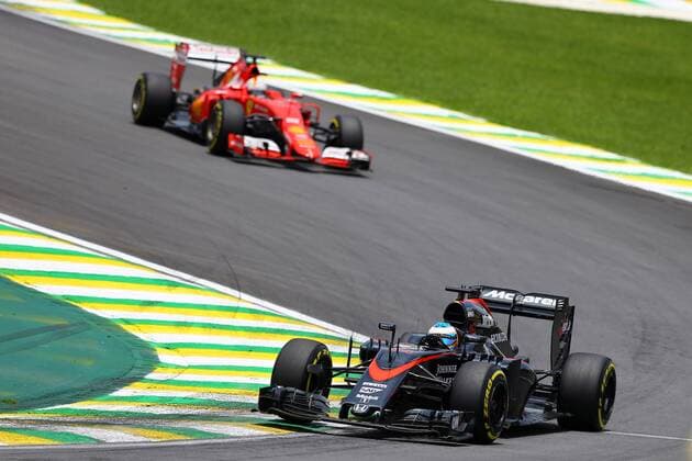 Brazilian Grand Prix, Sao Paulo 12 - 15 November 2015 14.11.2015 - Free Practice 3, Fernando Alonso (ESP) McLaren Honda MP4-30 and Sebastian Vettel (GER) Scuderia Ferrari SF15-T 