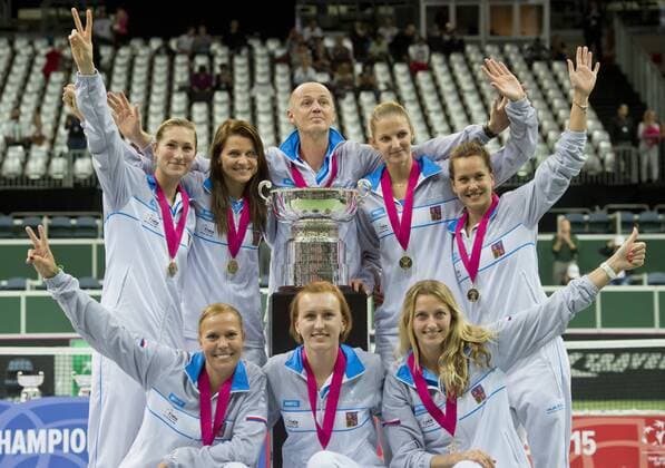 Czech Republic team players Lucie Hradecka (L-R bottom ), Tereza Smitkova, Petra Kvitova, Denisa Allertova (L-R), Lucie Safarova, Petr Pala, Karolina Pliskova, Barbora Strycova celebrate during the awarding ceremony for the Fed Cup tennis final match between Czech Republic and Russia in Prague, Czech Republic, November 15, 2015. Czech Republic beat Russia in tennis Fed Cup final 3-2 and defended title. (CTKxPhoto VitxSimanek) CTKPhotoP201511150755701 VIS 031