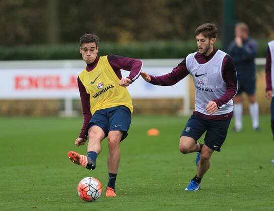 Tottenham s Harry Winks tussles with Adam Lallana during training England Training - Tottenham Hotspur Training Ground - England - 16th November 2015 - Picture David Klein Sportimage EDITORIAL USE ONLY. No use with unauthorised audio, video, data, fixture lists, club league logos or live services. Online in-match use limited to 120 images, no video emulation. No use in betting, games or single club league player publications.