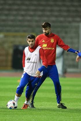 - BRUSSELS, BELGIUM: Spain s Alvaro Morata and Spain s Gerard Pique fight for the ball during a training session of the Spanish national soccer team, Monday 16 November 2015, in Brussels. Tomorrow Spain is playing the Red Devils, the Belgian national soccer team, in preparation of the Euro2016 European Championships. BRUNOxFAHY  x04741436x