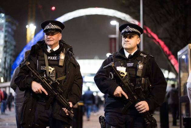 Armed police outside the Stadium - Breast Cancer Care International - England v France - Wembley Stadium - London - England - 17th November 2015 - Picture Charlie Forgham Bailey Sportimage EDITORIAL USE ONLY. No use with unauthorised audio, video, data, fixture lists, club league logos or live services. Online in-match use limited to 120 images, no video emulation. No use in betting, games or single club league player publications.