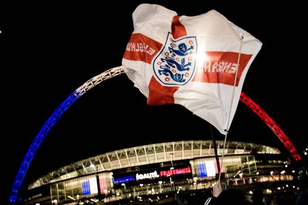 England flags outside the stadium - Breast Cancer Care International - England v France - Wembley Stadium - London - England - 17th November 2015 - Picture Charlie Forgham Bailey Sportimage EDITORIAL USE ONLY. No use with unauthorised audio, video, data, fixture lists, club league logos or live services. Online in-match use limited to 120 images, no video emulation. No use in betting, games or single club league player publications.