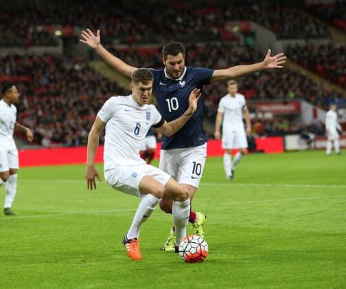 England s John Stones tussles with France s Andre-Pierre Gignac International Friendly Länderspiel Match- England v France - Wembley Stadium - England - 17th November 2015 - Picture David Klein Sportimage EDITORIAL USE ONLY. No use with unauthorised audio, video, data, fixture lists, club league logos or live services. Online in-match use limited to 120 images, no video emulation. No use in betting, games or single club league player publications.