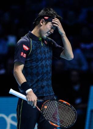 (151120) -- LONDON, Nov. 19, 2015 -- Kei Nishikori of Japan reacts during a men s singles group stage match against Roger Federer of Switzerland at the ATP Tennis Herren World Tour Finals in London, Britain, Nov. 19, 2015. Kei Nishikori lost the match 1-2. ) (SP)BRITAIN-LONDON-TENNIS-ATP FINAL TangxShi 