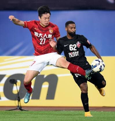(151121) -- GUANGZHOU, Nov. 21, 2015 -- Zheng Long (L) of Guangzhou Evergrande competes during the 2nd round of the AFC Champions League final match between Guangzhou Evergrande and Al Ahli of United Arab Emirates in Guangzhou, China, Nov. 21, 2015. ) (SP)CHINA-GUANGZHOU-SOCCER-AFC CHAMPIONS LEAGUE-FINAL (CN) GuoxYong 