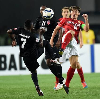 (151121) -- GUANGZHOU, Nov. 21, 2015 -- Zheng Zhi (1st, R) of Guangzhou Evergrande competes during the 2nd round of the AFC Champions League final match between Guangzhou Evergrande and Al Ahli of United Arab Emirates in Guangzhou, China, Nov. 21, 2015. ) (SP)CHINA-GUANGZHOU-SOCCER-AFC CHAMPIONS LEAGUE-FINAL (CN) GuoxYong 