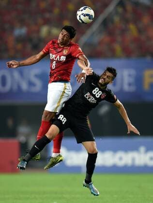 (151121) -- GUANGZHOU, Nov. 21, 2015 -- Polinho (L) of Guangzhou Evergrande competes during the 2nd round of the AFC Champions League final match between Guangzhou Evergrande and Al Ahli of United Arab Emirates in Guangzhou, China, Nov. 21, 2015. ) (SP)CHINA-GUANGZHOU-SOCCER-AFC CHAMPIONS LEAGUE-FINAL (CN) GuoxYong 