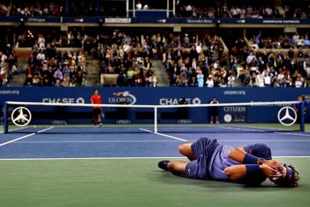 Rafael Nadal of Spain celebrates victory as Novak Djokovic of Serbia walks back to his chair after their men s singles final match against Novak Djokovic of Serbia on Day Fifteen of the 2013 US Open at the USTA Billie Jean King National Tennis Center on September 9, 2013 in the Flushing neighborhood of the Queens borough of New York City. Sports Photojournalist of the Year - Al Bello s Portfolio  - ZUMA233_