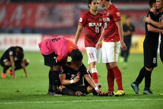 (151121) -- GUANGZHOU, Nov. 21, 2015 -- Players of Al Ahli of United Arab Emirates react after the 2nd round of the AFC Champions League final match between Guangzhou Evergrande and Al Ahli of United Arab Emirates in Guangzhou, China, Nov. 21, 2015. Guangzhou Evergrande won 1-0 and claimed the title. ) (SP)CHINA-GUANGZHOU-SOCCER-AFC CHAMPIONS LEAGUE-FINAL (CN) GuoxYong 