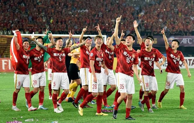 Players of Guangzhou Evergrande celebrate after winning the AFC Champions League final match between Guangzhou Evergrande and Al Ahli of United Arab Emirates in Guangzhou, China, Nov. 21, 2015. Guangzhou Evergrande won 1-0 and claimed the title. ) (SP)CHINA-GUANGZHOU-SOCCER-AFC CHAMPIONS LEAGUE-FINAL (CN) LiuxDawei 