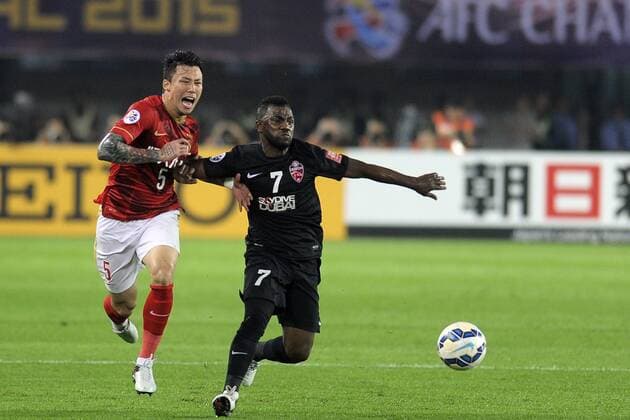 GUANGZHOU, CHINA - NOVEMBER 21: (CHINA OUT) Zhang Linpeng 5 of Guangzhou Evergrande and Ismail Al Hammadi 7 of Al Ahli compete for the ball during the second leg of the AFC Champions League final match between Guangzhou Evergrande and Al Ahli at the Tianhe Sports Center on November 21, 2015 in Guangzhou, China.  CFP476170807 