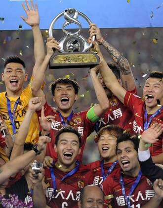 GUANGZHOU, CHINA - NOVEMBER 21: (CHINA OUT) Guangzhou Evergrande players celebrate with the trophy after winning the second leg of the AFC Champions League final match between Guangzhou Evergrande and Al Ahli at the Tianhe Sports Center on November 21, 2015 in Guangzhou, China.  CFP476177639 