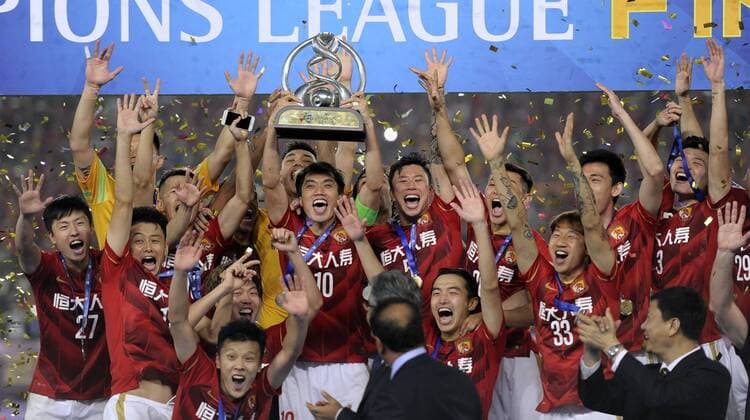 GUANGZHOU, CHINA - NOVEMBER 21: (CHINA OUT) Guangzhou Evergrande players celebrate with the trophy after winning the second leg of the AFC Champions League final match between Guangzhou Evergrande and Al Ahli at the Tianhe Sports Center on November 21, 2015 in Guangzhou, China.  CFP476177640 