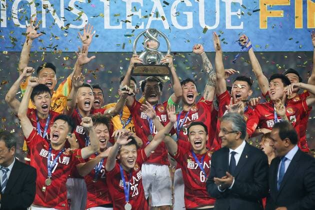 GUANGZHOU, CHINA - NOVEMBER 21: (CHINA OUT) Guangzhou Evergrande players celebrate with the trophy after winning the second leg of the AFC Champions League final match between Guangzhou Evergrande and Al Ahli at the Tianhe Sports Center on November 21, 2015 in Guangzhou, China.  CFP476177649 
