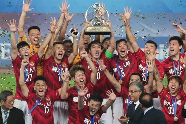 GUANGZHOU, CHINA - NOVEMBER 21: (CHINA OUT) Guangzhou Evergrande players celebrate with the trophy after winning the second leg of the AFC Champions League final match between Guangzhou Evergrande and Al Ahli at the Tianhe Sports Center on November 21, 2015 in Guangzhou, China.  CFP476177656 