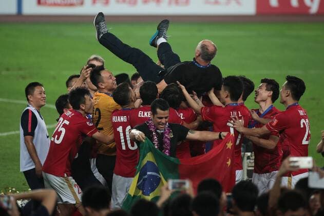 GUANGZHOU, CHINA - NOVEMBER 21: (CHINA OUT) Luiz Felipe Scolari, head coach of Guangzhou Evergrande, is thrown in the air by his players as they celebrate after winning the second leg of the AFC Champions League final match between Guangzhou Evergrande and Al Ahli at the Tianhe Sports Center on November 21, 2015 in Guangzhou, China.  CFP476177701 