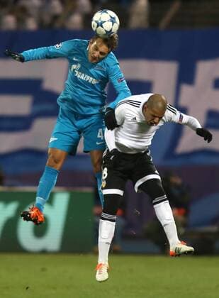 ST. PETERSBURG, RUSSIA. NOVEMBER 24, 2015. Zenit s Domenico Criscito (L) and Valencia s Sofiane Feghouli fight for the ball in their 2015 16 Season UEFA Champions League Group H Round 5 football match at Petrovsky Stadium. FC Zenit St. Petersburg won the game 2:0. Alexander Demianchuk TASS  TS01287E