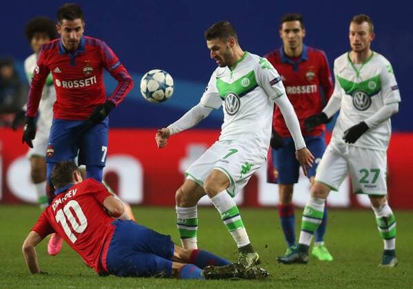 MOSCOW REGION, RUSSIA. NOVEMBER 25, 2015. CSKA s Zoran Tosic, Alan Dzagoev and Wolfsburg s Daniel Caligiuri, Maximilian Arnold (L-R) fighr for the ball in their 2015 16 Season UEFA Champions League Group B Round 5 football match at the Arena Khimki Stadium. FC Wolfsburg won the game 2:0. Sergei Fadeichev TASS  TS0129CF