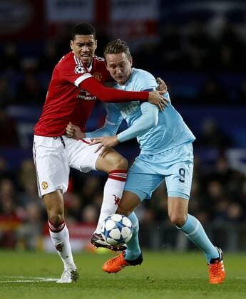 Chris Smalling of Manchester United ManU getting to grips with Luuk de Jong of PSV Eindhoven - UEFA Champions League Group B - Manchester Utd vs PSV Eindhoven - Old Trafford Stadium - Manchester - England - 25th November 2015 - Pic Simon Bellis Sportimage EDITORIAL USE ONLY. No use with unauthorised audio, video, data, fixture lists, club league logos or live services. Online in-match use limited to 120 images, no video emulation. No use in betting, games or single club league player publications.
