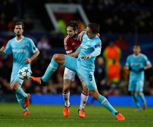 Luuk de Jong of PSV Eindhoven tackled by Daley Blind of Manchester United ManU - UEFA Champions League Group B - Manchester Utd vs PSV Eindhoven - Old Trafford Stadium - Manchester - England - 25th November 2015 - Pic Simon Bellis Sportimage EDITORIAL USE ONLY. No use with unauthorised audio, video, data, fixture lists, club league logos or live services. Online in-match use limited to 120 images, no video emulation. No use in betting, games or single club league player publications.