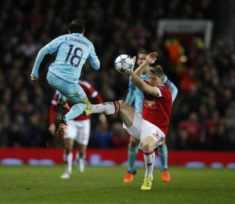 Andres Guarded of PSV Eindhoven tackeld by Bastian Schweinsteiger of Manchester United ManU - UEFA Champions League Group B - Manchester Utd vs PSV Eindhoven - Old Trafford Stadium - Manchester - England - 25th November 2015 - Pic Simon Bellis Sportimage EDITORIAL USE ONLY. No use with unauthorised audio, video, data, fixture lists, club league logos or live services. Online in-match use limited to 120 images, no video emulation. No use in betting, games or single club league player publications.