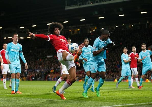 Mauroane Fellaini of Manchester United ManU attempt to keep the ball in the penalty area - UEFA Champions League Group B - Manchester Utd vs PSV Eindhoven - Old Trafford Stadium - Manchester - England - 25th November 2015 - Pic Simon Bellis Sportimage EDITORIAL USE ONLY. No use with unauthorised audio, video, data, fixture lists, club league logos or live services. Online in-match use limited to 120 images, no video emulation. No use in betting, games or single club league player publications.