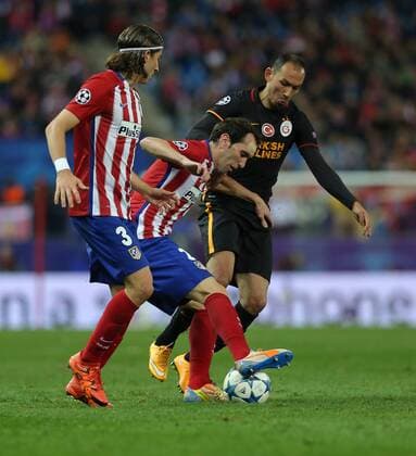 Champions League Group C football match between Atletico Madrid and Galatasaray at the Vicente Calderon stadium in Madrid, Spain, Wednesday Nov. 25, 2015. Final Score: Atletico Madrid 2 - Galatasaray 0 Pictured: Umut Bulut of Galatasaray and Diego Godin 2, Filipe Luis 3 of Atletico Madrid. 