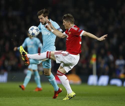 Bastian Schweinsteiger of Manchester United ManU clears the ball away from Davy Propper of PSV Eindhoven - UEFA Champions League Group B - Manchester Utd vs PSV Eindhoven - Old Trafford Stadium - Manchester - England - 25th November 2015 - Pic Simon Bellis Sportimage EDITORIAL USE ONLY. No use with unauthorised audio, video, data, fixture lists, club league logos or live services. Online in-match use limited to 120 images, no video emulation. No use in betting, games or single club league player publications.