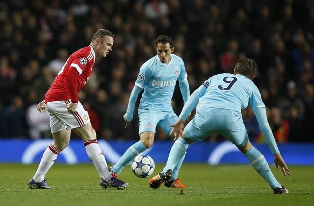 Wayne Rooney of Manchester United ManU pressured by Luuk de Jong of PSV Eindhoven - UEFA Champions League Group B - Manchester Utd vs PSV Eindhoven - Old Trafford Stadium - Manchester - England - 25th November 2015 - Pic Simon Bellis Sportimage EDITORIAL USE ONLY. No use with unauthorised audio, video, data, fixture lists, club league logos or live services. Online in-match use limited to 120 images, no video emulation. No use in betting, games or single club league player publications.