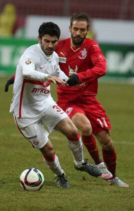 KAZAN, RUSSIA. NOVEMBER 30, 2015. Spartak s Serdar Tasci (L) and Rubin s Marko Devic fight for the ball in their 2015 16 Season Russian Premier League Round 17 football match at Kazan Arena Stadium. The game ended in a 2:2 draw. Yegor Aleyev TASS  TS012E7C