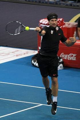 (151206) -- PASAY CITY, Dec. 6, 2015 -- Spanish player Carlos Moya of Singapore Slammers returns the ball against Russian player Marat Safin of Japan Warriors during their match in the International Premier Tennis League (IPTL) in Pasay City, the Philippines, Dec. 6, 2015. Carlos Moya won 6-4. ) (SP)PHILIPPINES-PASAY CITY-TENNIS-IPTL RouellexUmali 