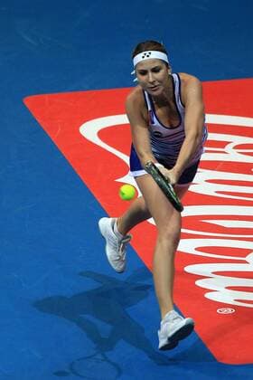 (151206) -- PASAY CITY, Dec. 6, 2015 -- Singapore Slammers player Belinda Bencic of Switzerland returns the ball against Japan Warriors player Kurumi Nara of Japan during their women s singles match in the International Premier Tennis League (IPTL) in Pasay City, the Philippines, Dec. 6, 2015. Belinda Bencic won 6-2. ) (SP)PHILIPPINES-PASAY CITY-TENNIS-IPTL RouellexUmali 