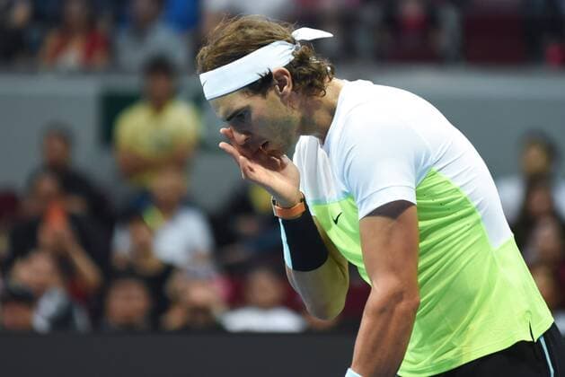 Dec. 8, 2015 - Manila, Philippines - MANILA, Philippines - SpainÃ¢â‚¬â ¢s Rafael Nadal of the Indian Aces touches his face during the menÃ¢â‚¬â ¢s singles match for the International Premiere Tennis League (IPTL) at the Mall of Asia Arena in Pasay City, south of Manila, Philippines on December 08, 2015. International Premiere Tennis League in Manila  - ZUMAn230