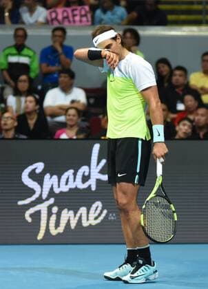 Dec. 8, 2015 - Manila, Philippines - MANILA, Philippines - SpainÃ¢â‚¬â ¢s Rafael Nadal of the Indian Aces touches wipes sweat off his face during the menÃ¢â‚¬â ¢s singles match for the International Premiere Tennis League (IPTL) at the Mall of Asia Arena in Pasay City, south of Manila, Philippines on December 08, 2015. International Premiere Tennis League in Manila  - ZUMAn230