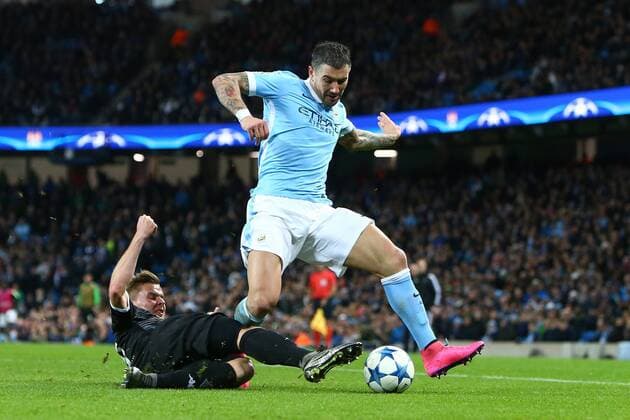 Nico Elvedi of Monchengladbach tackles Aleksander Kolarov of Manchester City - Manchester City vs Monchengladbach - UEFA Champions League - Etihad Stadium - Manchester - 08 12 2015 Pic Philip Oldham SportImage EDITORIAL USE ONLY. No use with unauthorised audio, video, data, fixture lists, club league logos or live services. Online in-match use limited to 120 images, no video emulation. No use in betting, games or single club league player publications.