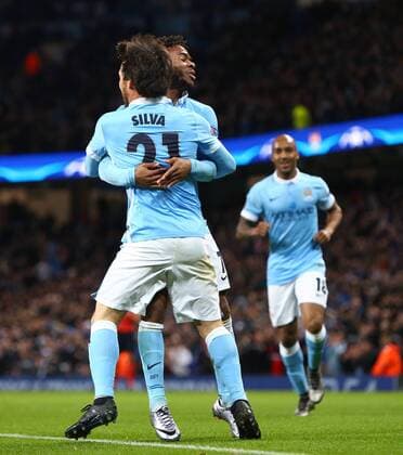 Fußball, Champions League, Manchester City - Borussia Mönchengladbach David Silva of Manchester City celebrates his opening goal with Raheem Sterling - Manchester City vs Monchengladbach - UEFA Champions League - Etihad Stadium - Manchester - 08 12 2015 Pic Philip Oldham SportImage EDITORIAL USE ONLY. No use with unauthorised audio, video, data, fixture lists, club league logos or live services. Online in-match use limited to 120 images, no video emulation. No use in betting, games or single club league player publications.