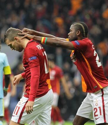 UEFA Champions League Group C soccer match between Galatasaray - Astana in Istanbul, Turkey, 08 December 2015. Fial Score: Galatasaray 1 - Astana 1 Pictured: Aurelien Chedjou and Lukas Podolski of Galatasaray. 
