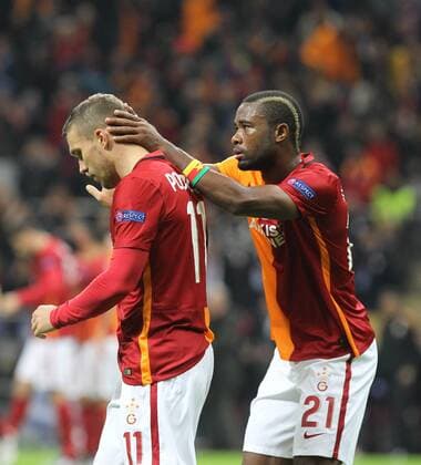 UEFA Champions League Group C soccer match between Galatasaray - Astana in Istanbul, Turkey, 08 December 2015. Fial Score: Galatasaray 1 - Astana 1 Pictured: Aurelien Chedjou and Lukas Podolski of Galatasaray. 